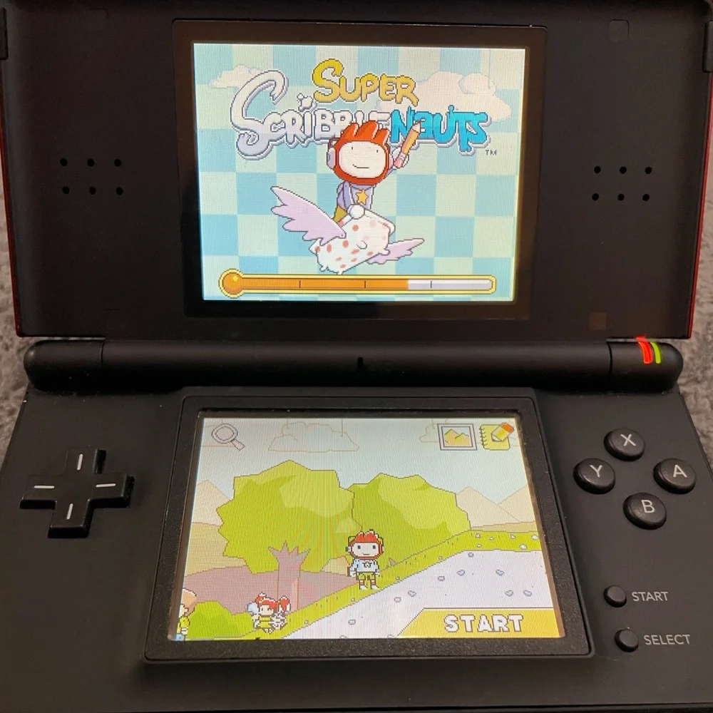 Nintendo DS Lite- excellent condition - comes with 13 games +